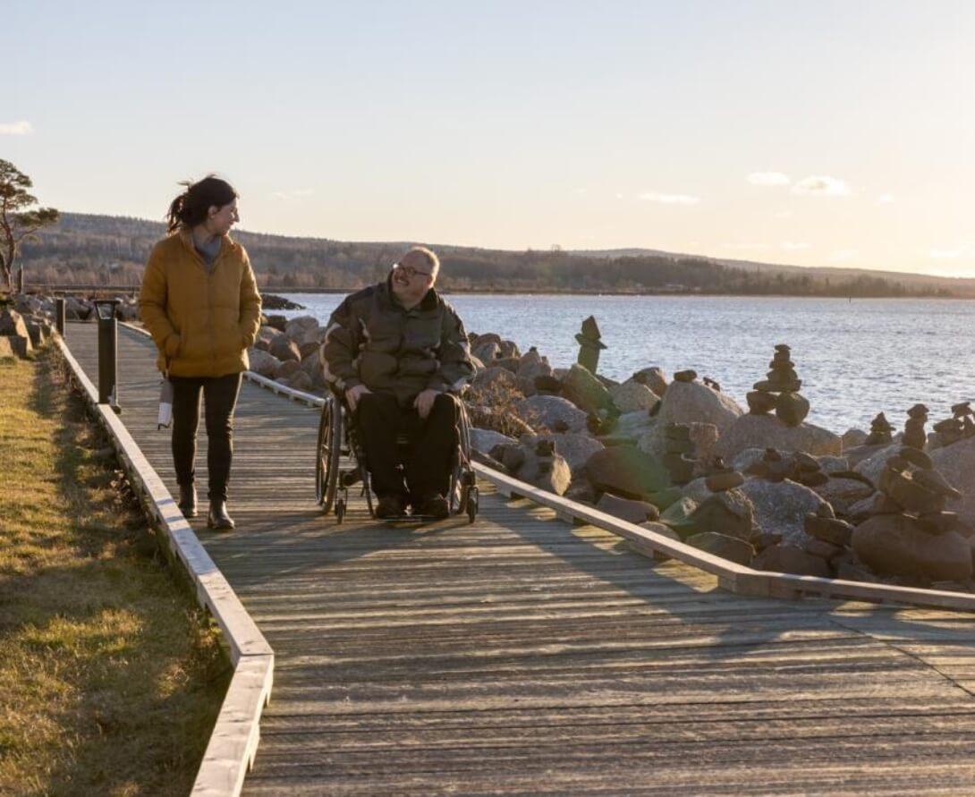 Two people on boardwalk